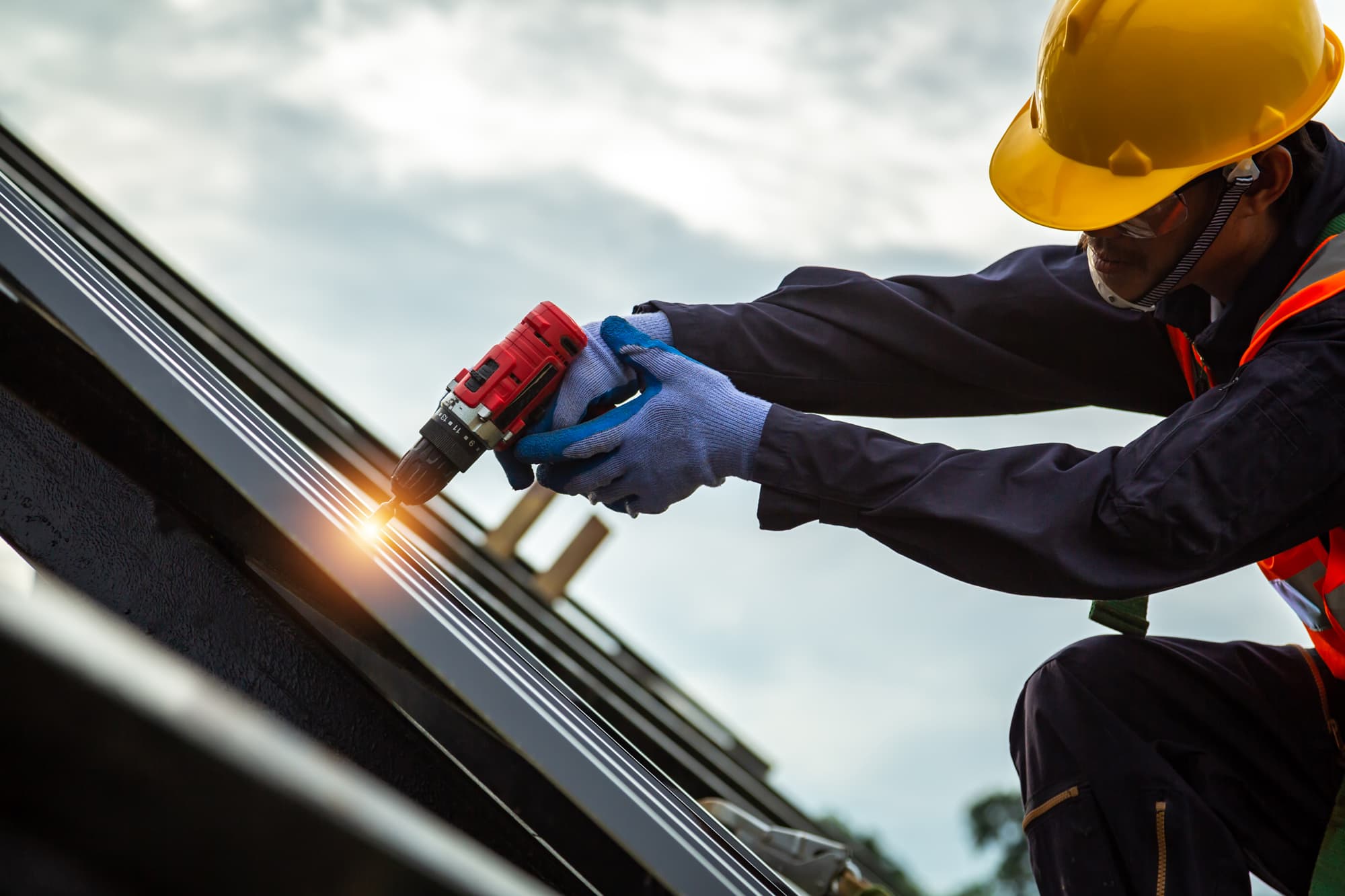 Craftsman installing metal roofing panels